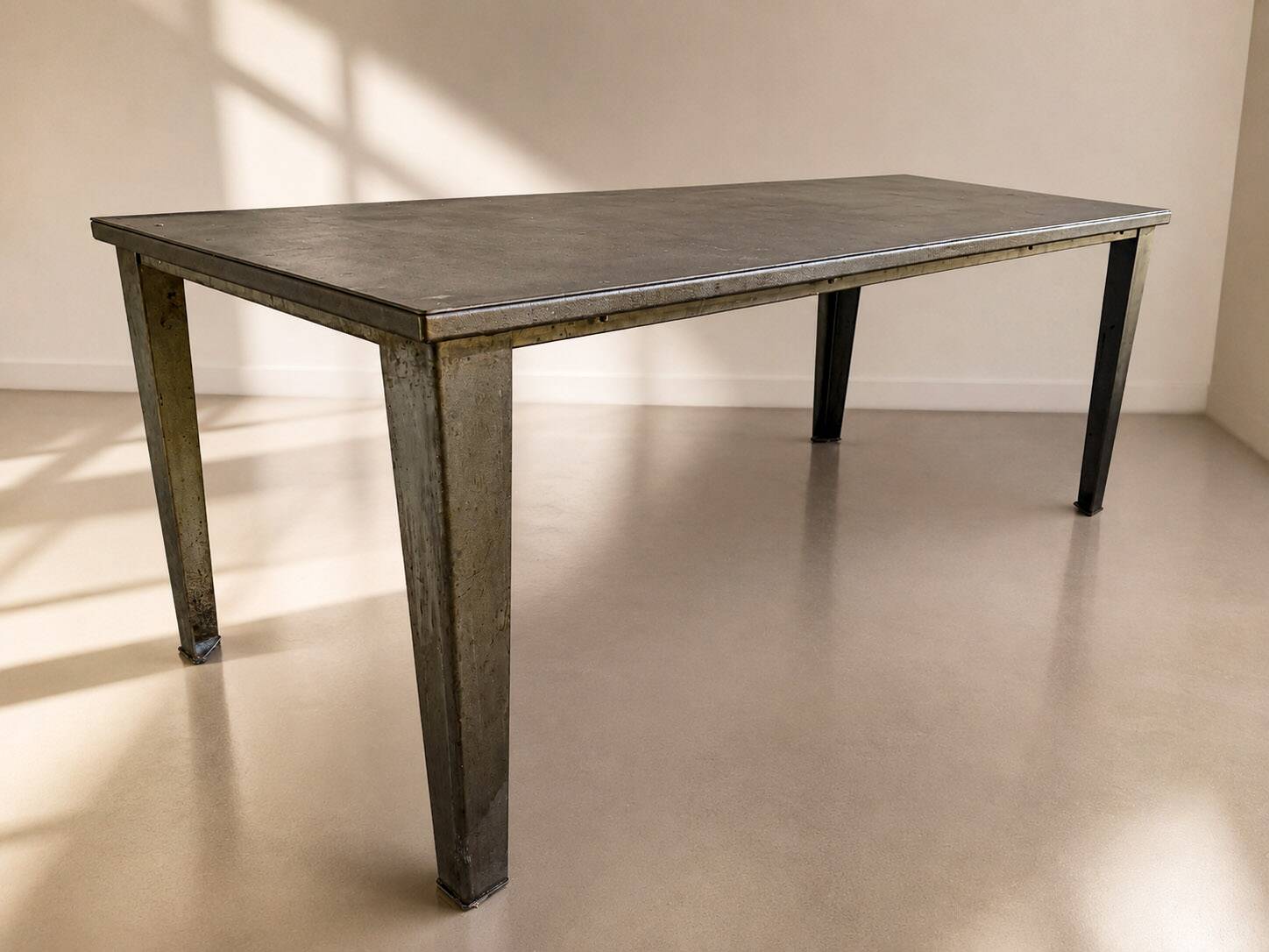 Industrial table made from old bumper car flooring.