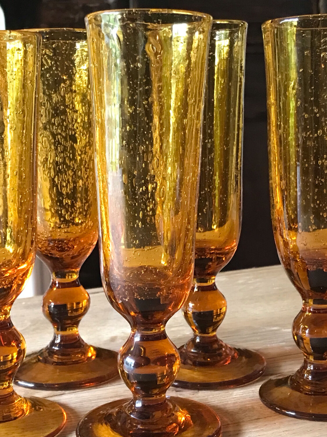 Champagne flutes bubbled amber blown
