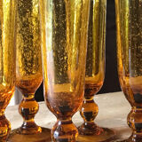Champagne flutes bubbled amber blown