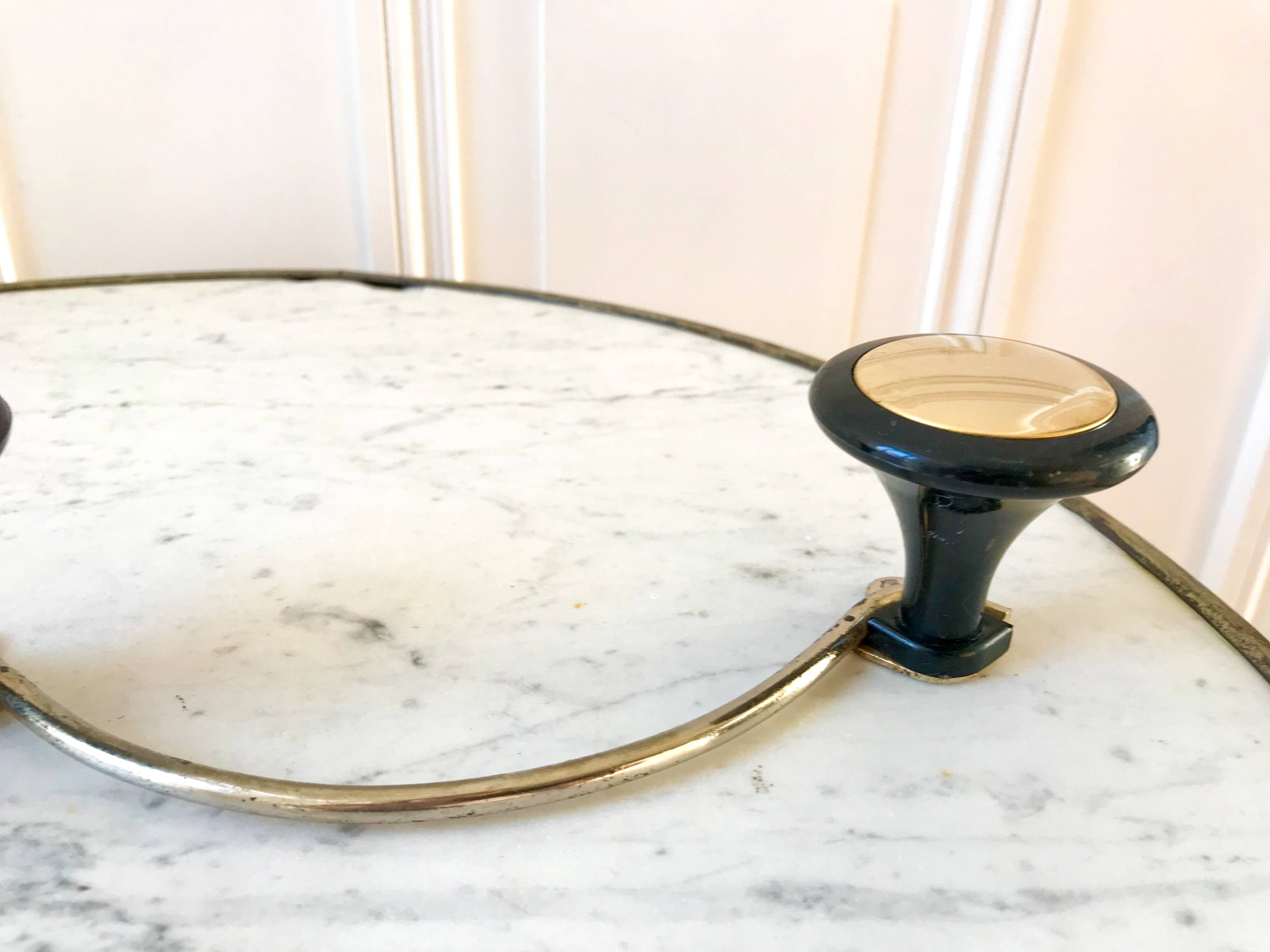 silver and black metal coat hook from the 70s
