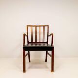 Mid-century armchair by Ole Wanscher for Fritz Hansen, stained beech and leather.