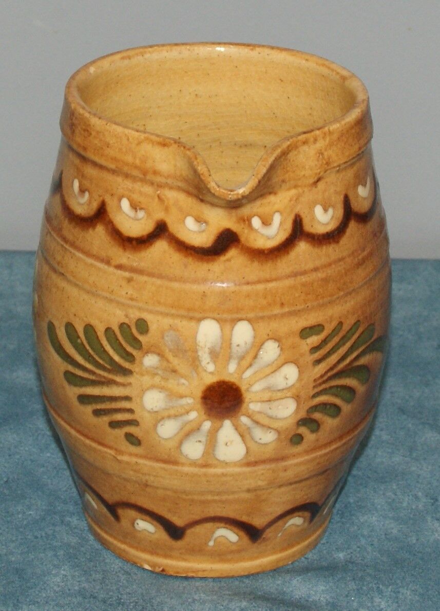 Glazed terracotta pitcher decorated with friezes and flowers