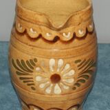 Glazed terracotta pitcher decorated with friezes and flowers