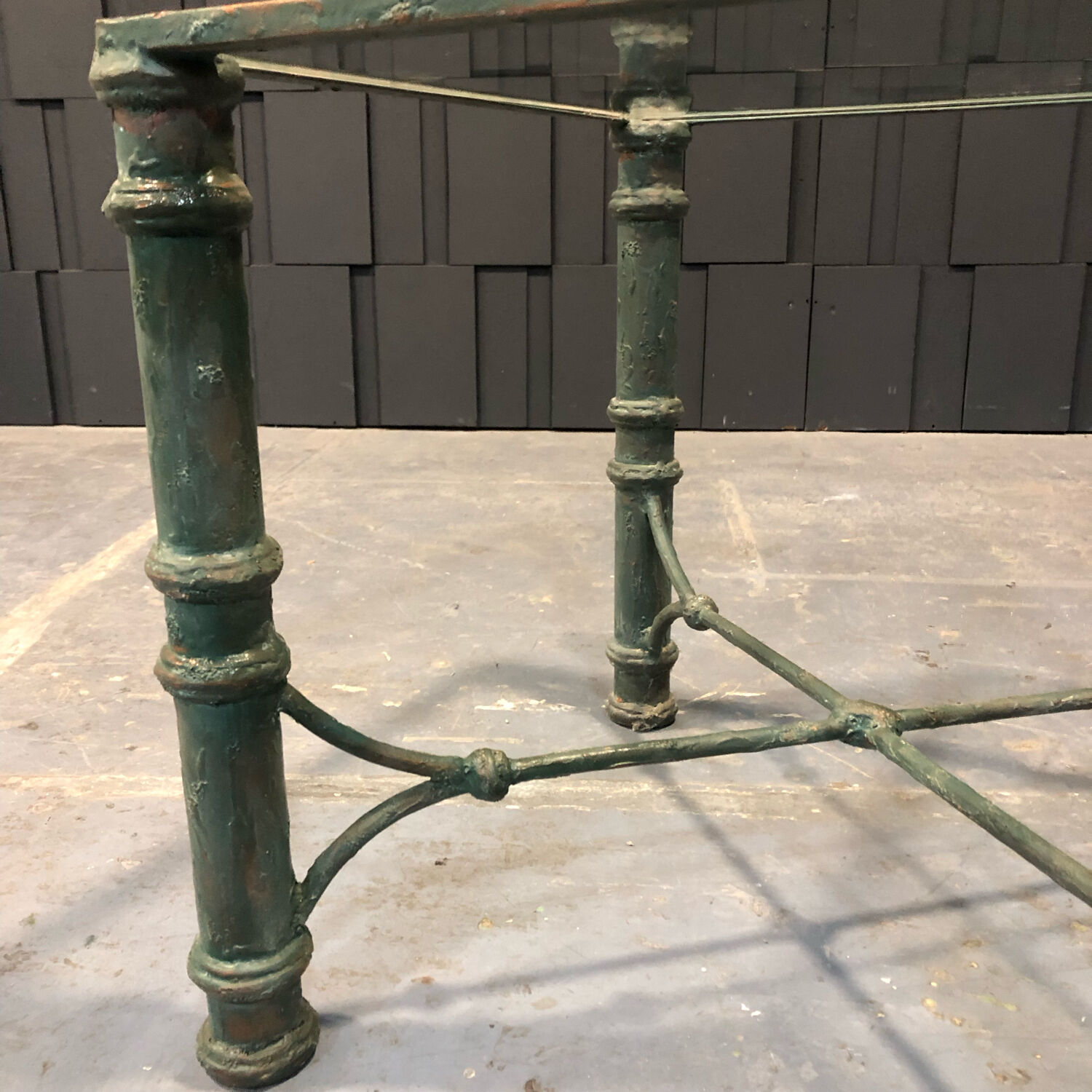 Iron and glass side table with antique patina
