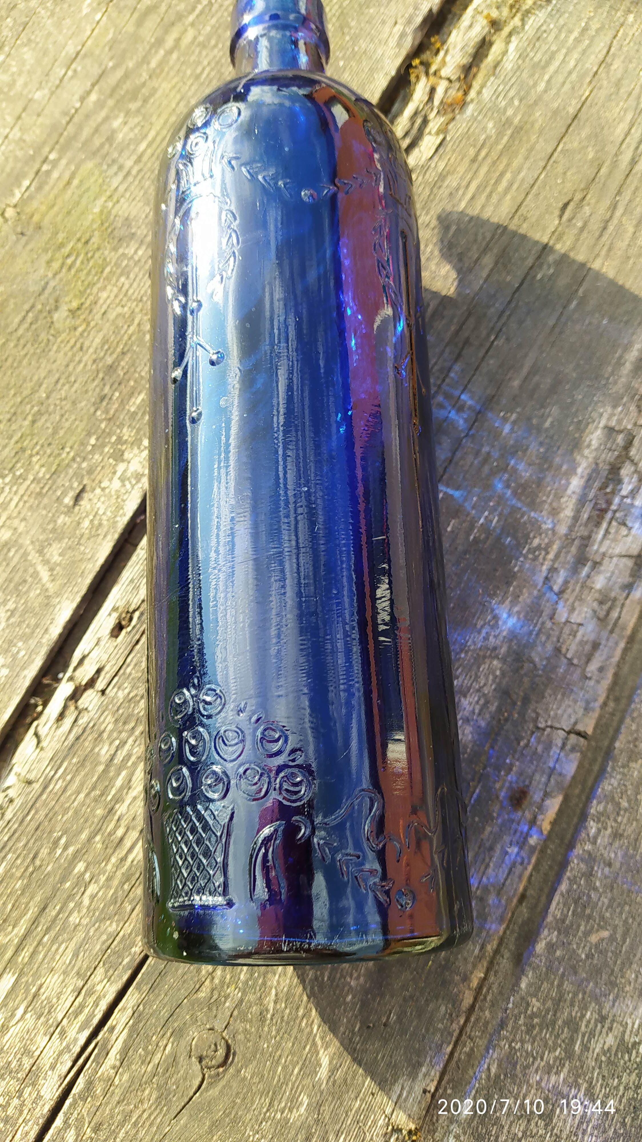 Vintage decorated glass bottle