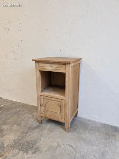 Antique wooden bedside table with a pink/orange marble top.