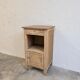 Antique wooden bedside table with a pink/orange marble top.