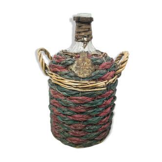 Demijohn dressed in straw and wicker