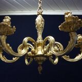 Massive bronze chandelier for candles.