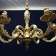 Massive bronze chandelier for candles.