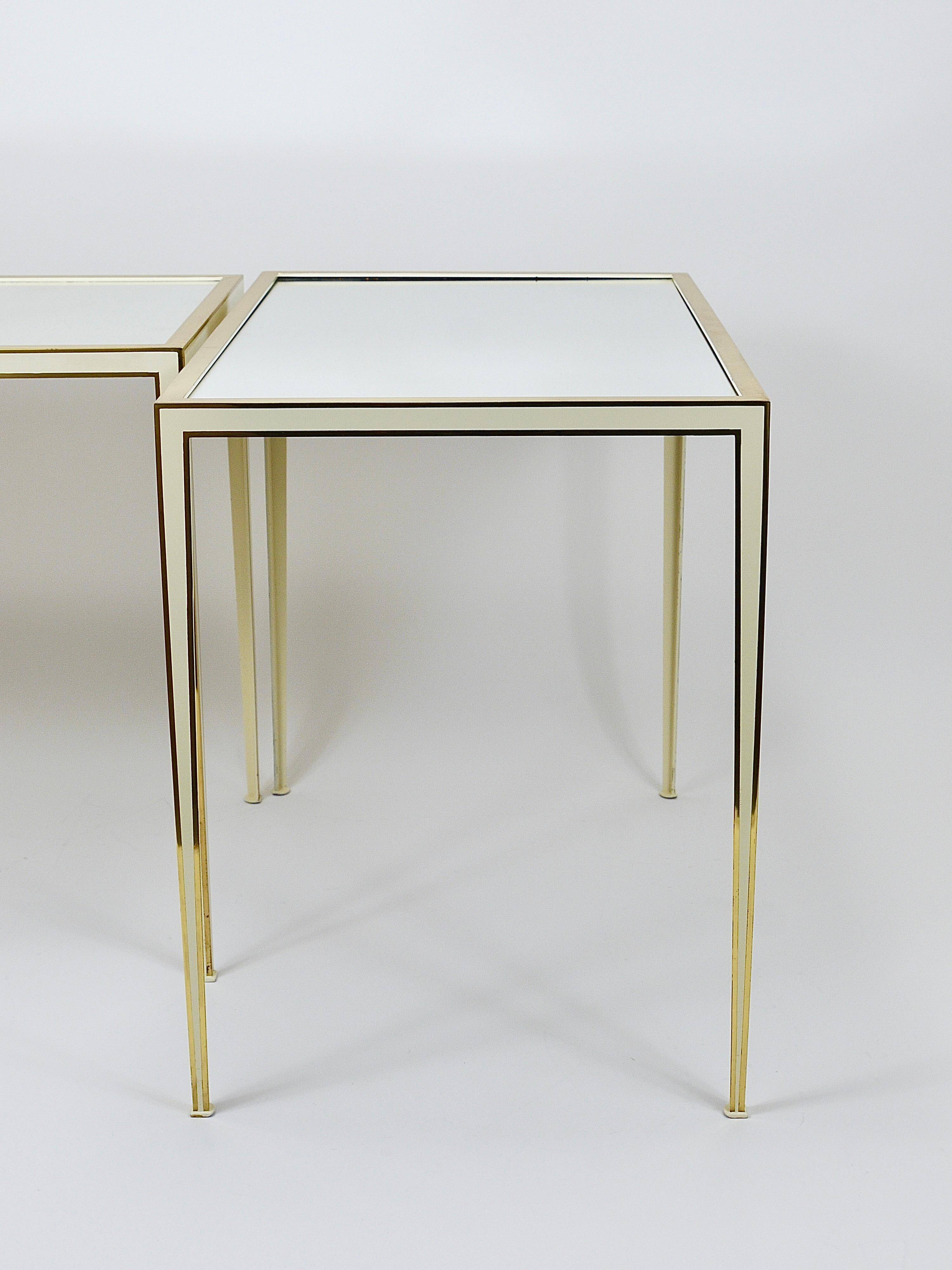 A pair of brass and white mirror tables from Vereinigte Werkstätten, Germany, 1970s.