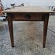 Large antique farmhouse table with a drawer