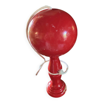 Large red wooden cup-and-ball game, 9 cm in diameter.