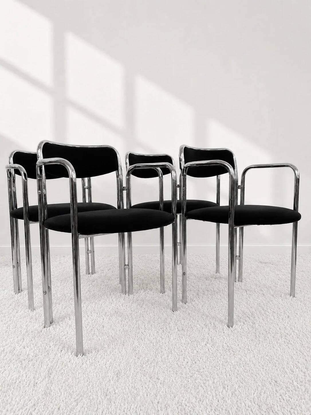 Vintage chairs with double chrome structure and black velvet. 70s