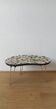 Unusual coffee table on three legs
