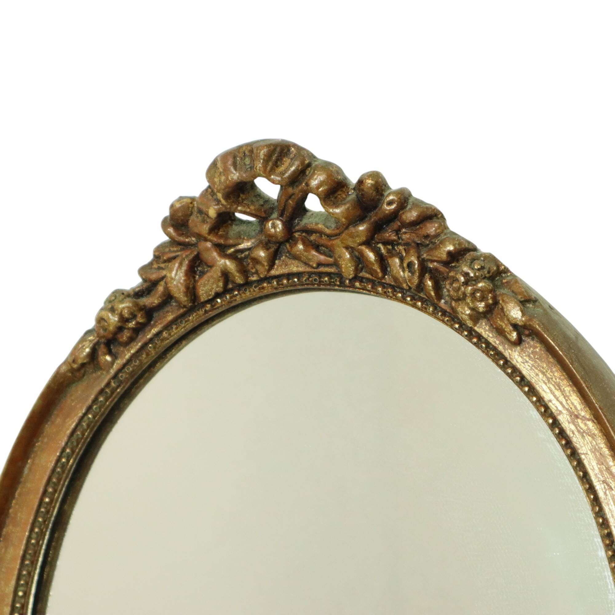 Miroir ovale vintage en résine dorée à la feuille d'or, style années 60. Classique.