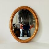 Antique oval mirror in gilded solid wood
