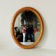 Antique oval mirror in gilded solid wood