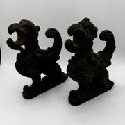 Pair of winged chimera and dragon fire dogs in cast iron