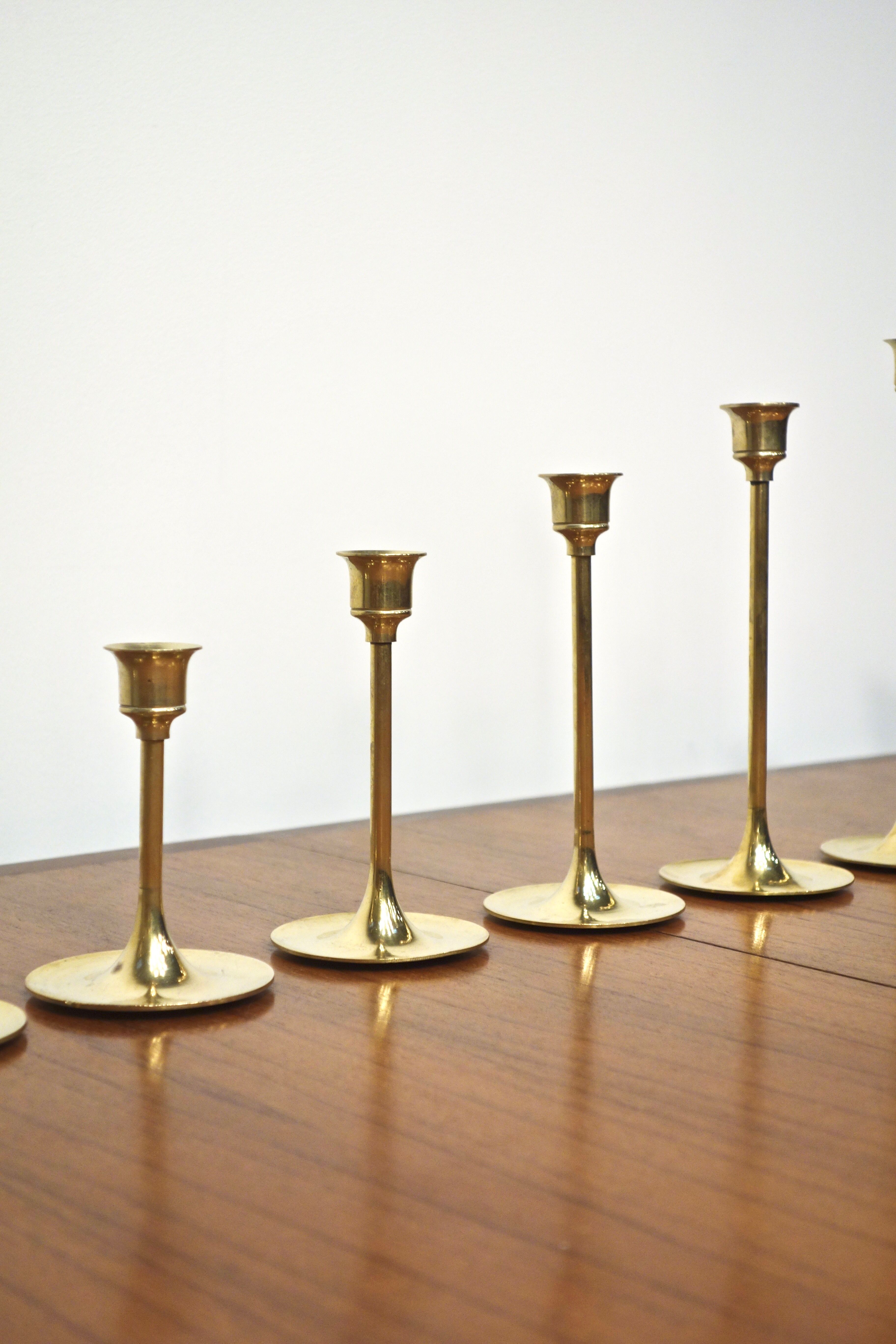 Set of 7 Scandinavian brass candle holders, 1960's