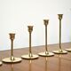 Set of 7 Scandinavian brass candle holders, 1960's