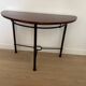 Half-moon console grange in solid cherry wood and wrought iron with a glass top.