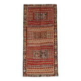 Kilim anatolien ancien tons rouges et beiges, motifs tribaux colorés