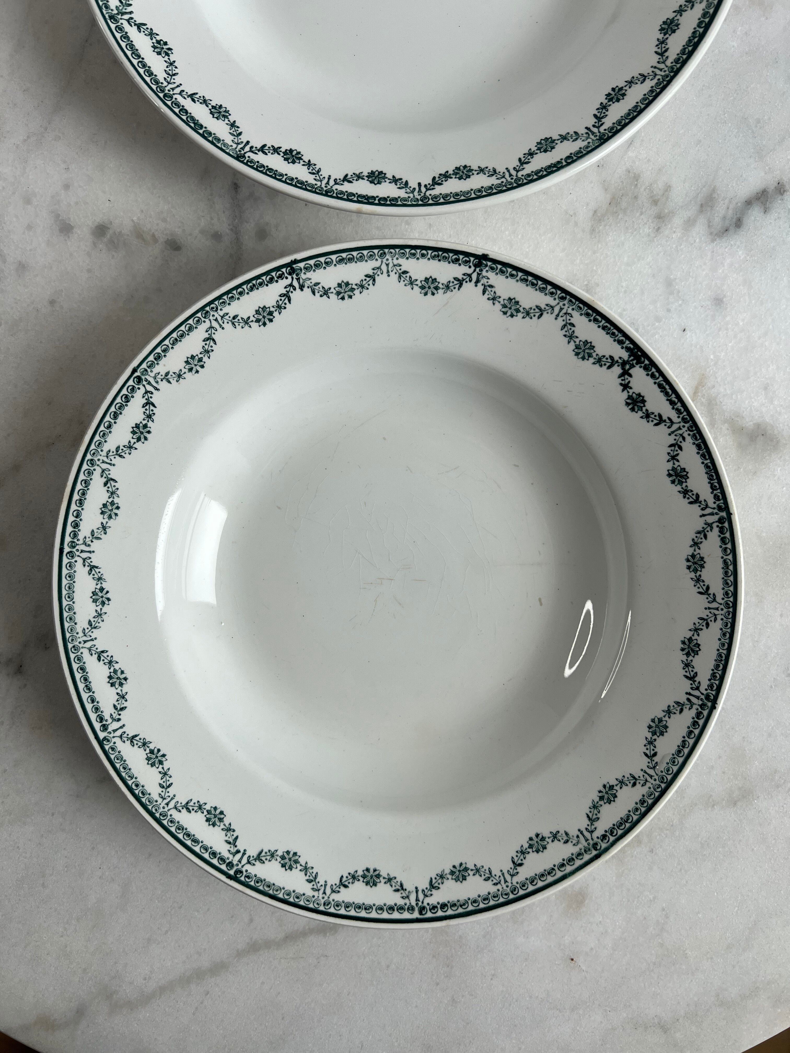 Set of two green frilled deep plates from Saint-Amand.