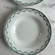 Set of two green frilled deep plates from Saint-Amand.