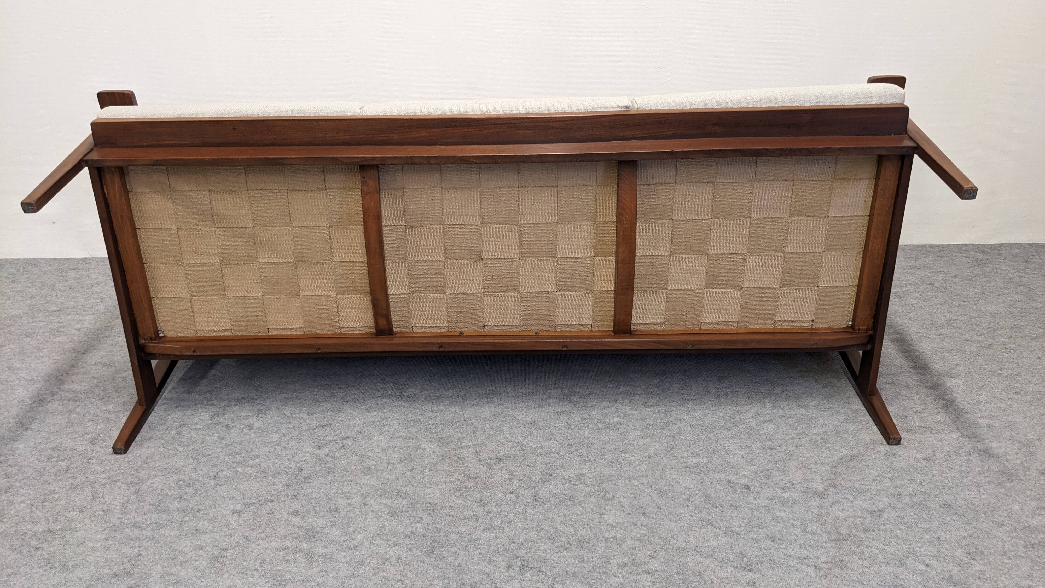 Scandinavian style three-seater sofa in teak, France circa 1950.