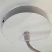 Old pendant light with a white opaline glass shade and a wavy border.