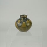 Sandstone ball vase by Eugène Lion