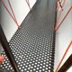 Vintage perforated metal magazine rack with cord handles by Matégot from the 1950s-60s.