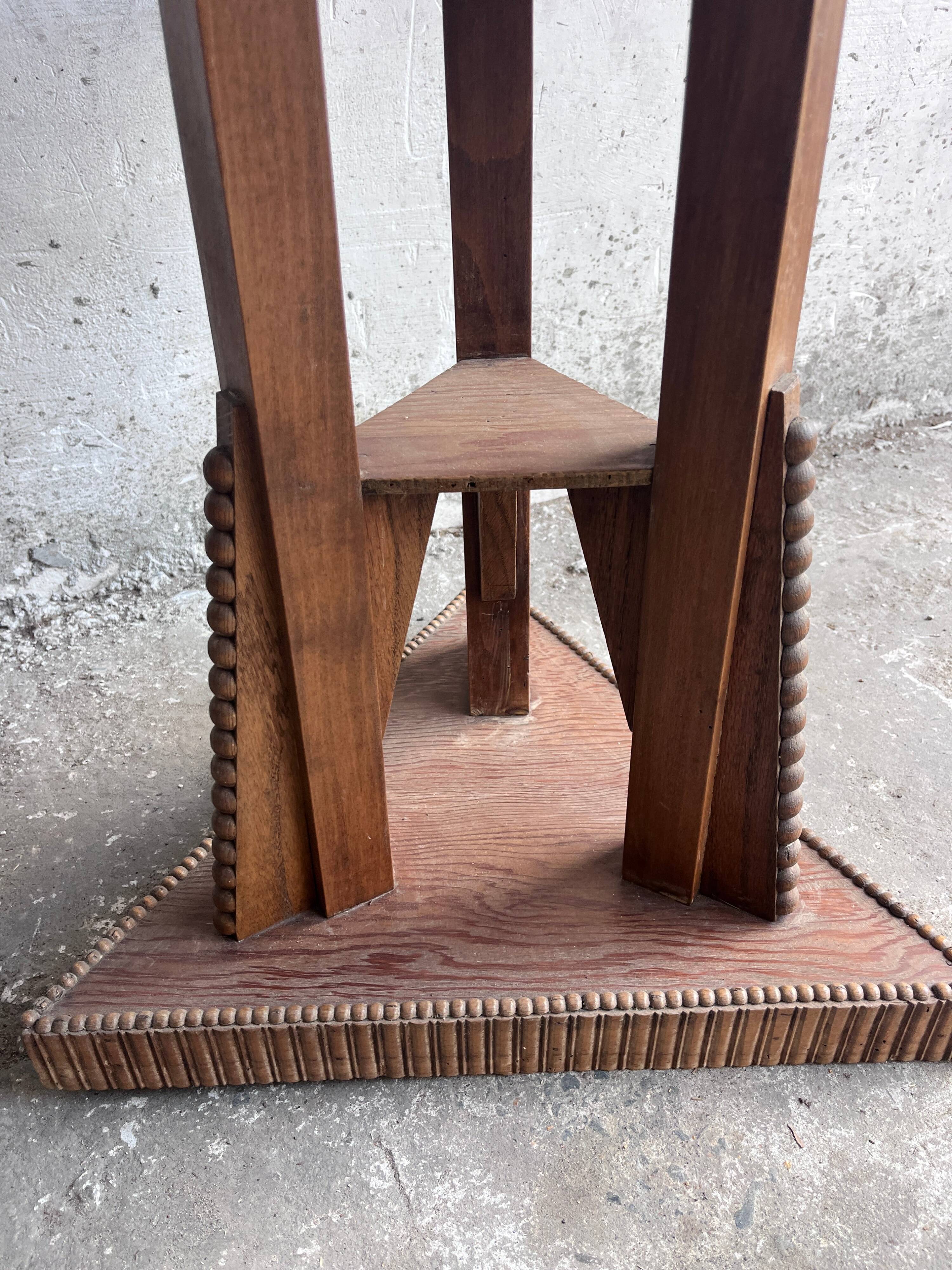 Triangular side table in carved wood, Art Nouveau, France, circa 1915.