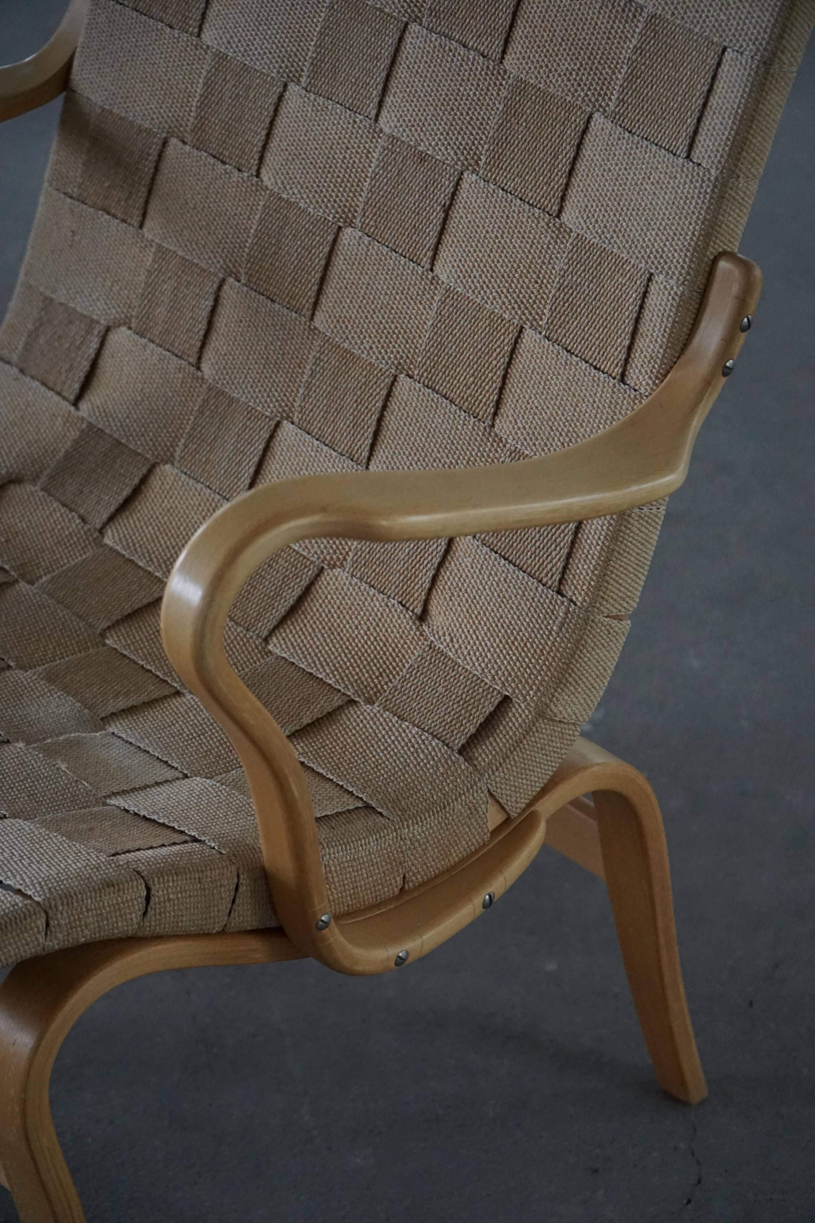 Pair of Swedish armchairs from the mid-century by Bruno Mathsson, model "Eva", 1960s.