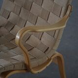 Pair of Swedish armchairs from the mid-century by Bruno Mathsson, model "Eva", 1960s.