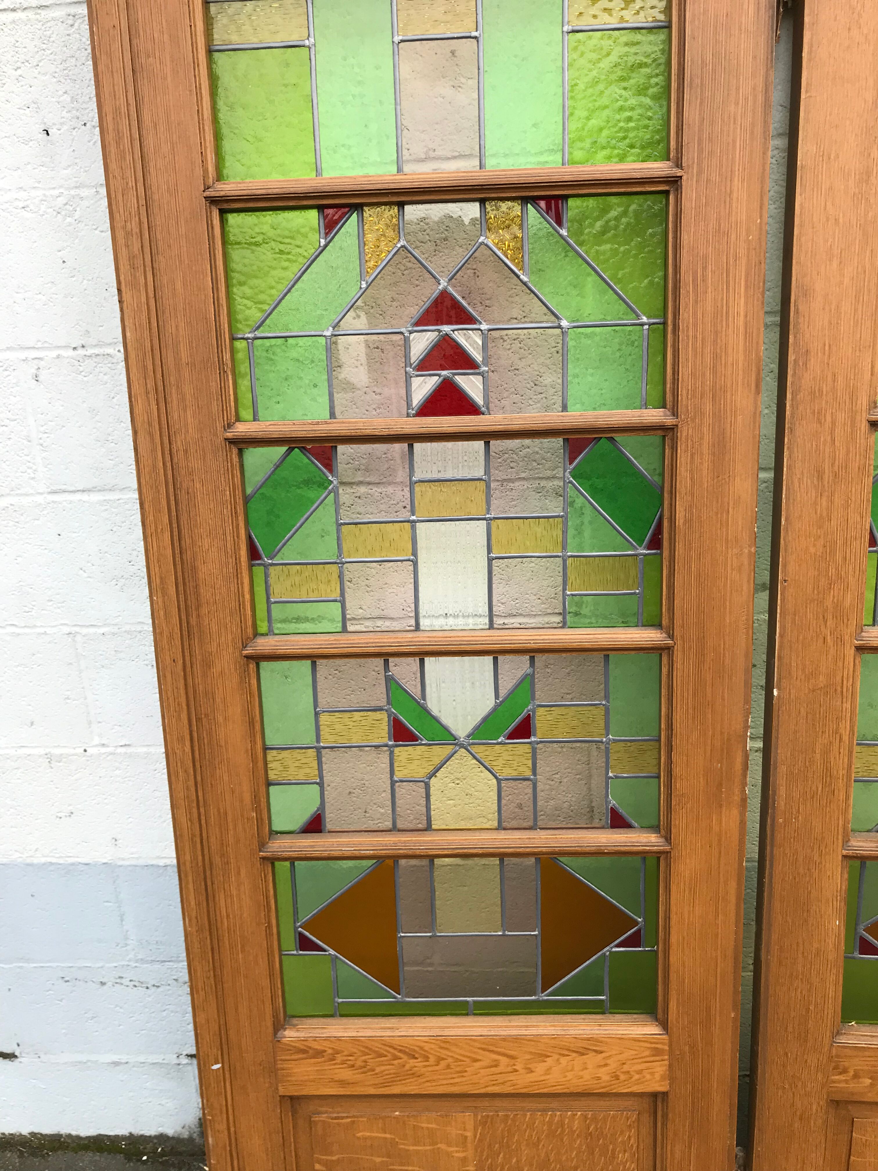Series of three doors with stained glass windows
