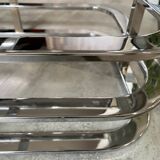 Coffee table with chrome base and mirrored glass top, vintage solar flare decor