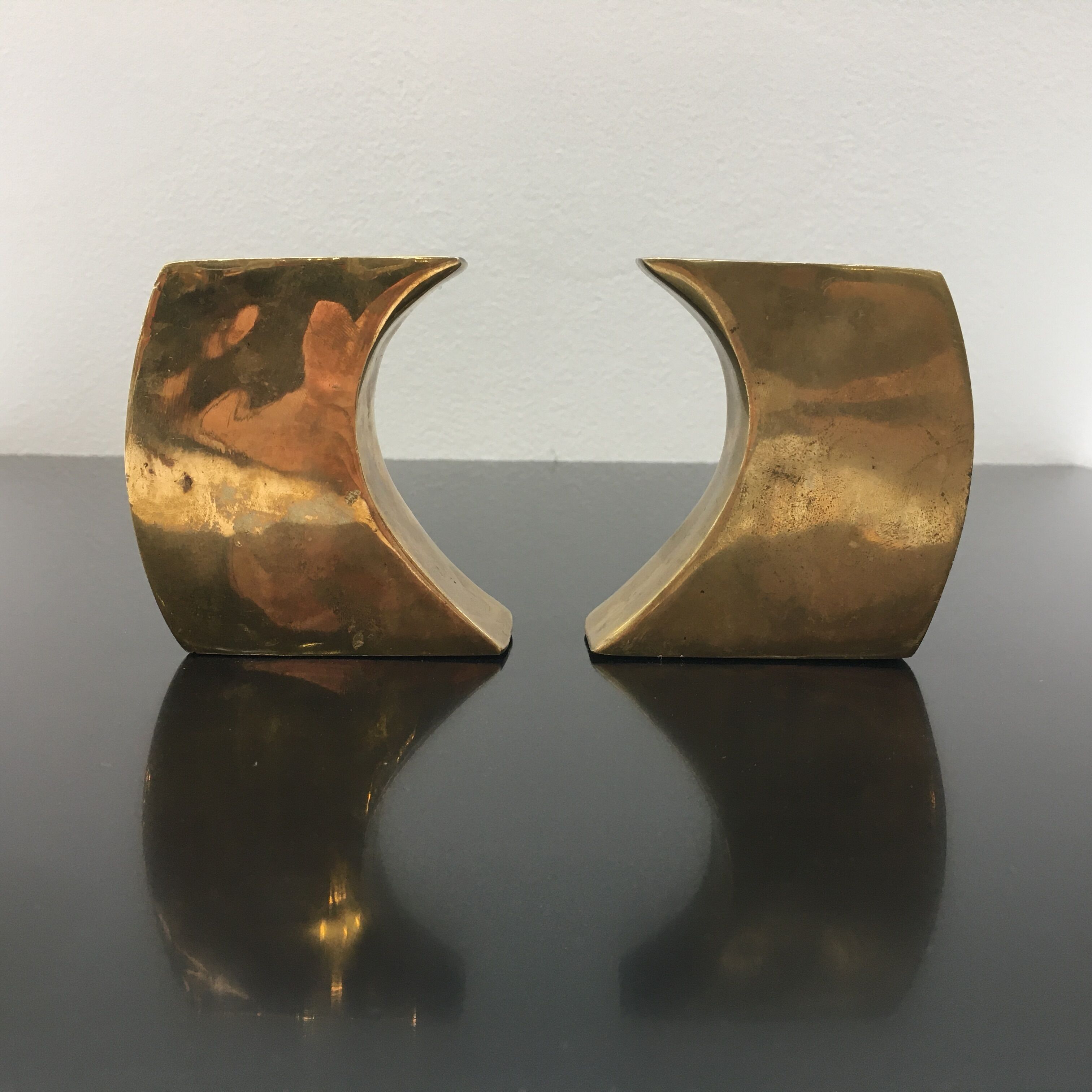 Pair of bronze candle holders by Monique Gerber