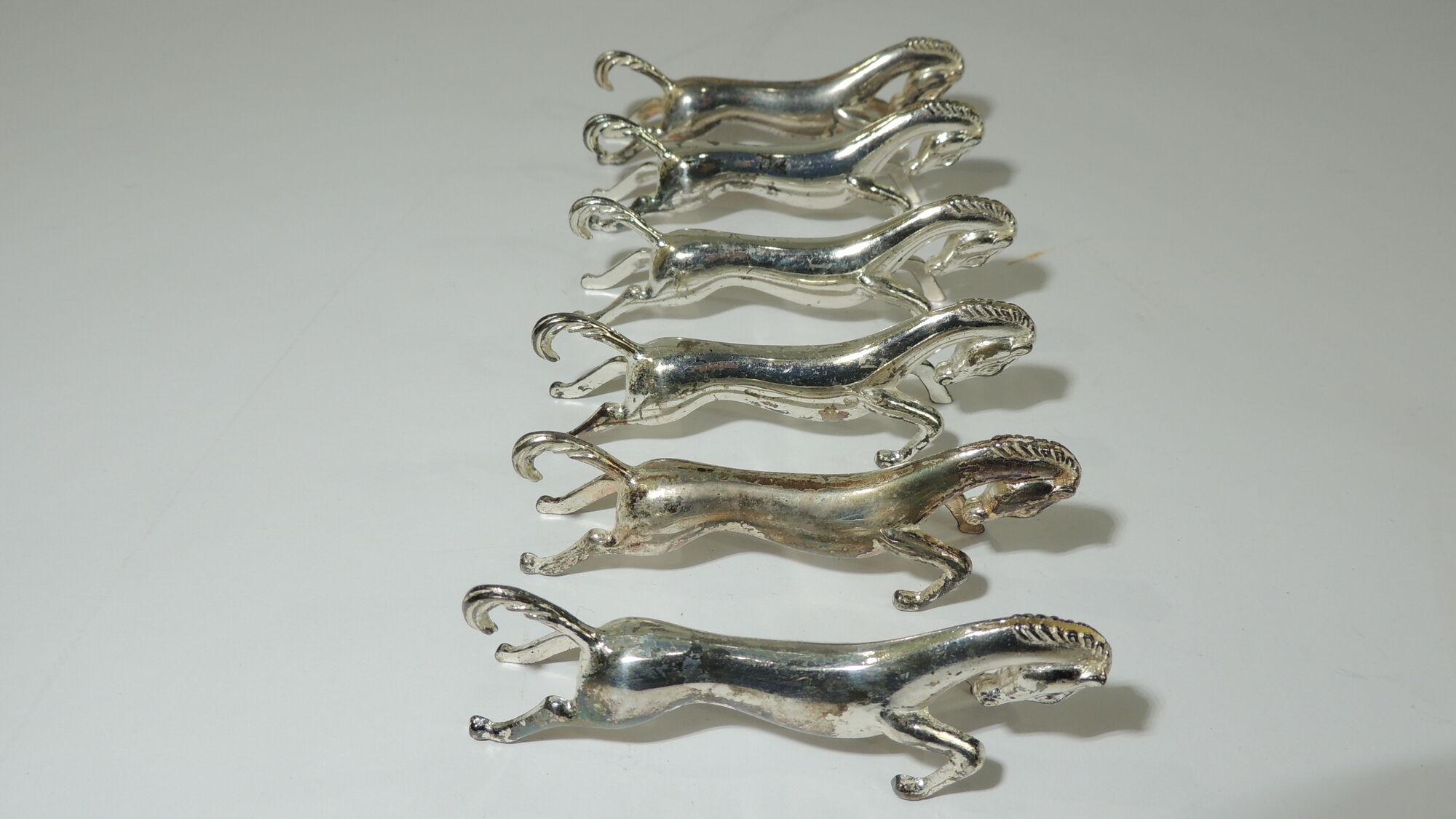 Lot 17 porte couteaux métal /chien /cheveaux/vintage