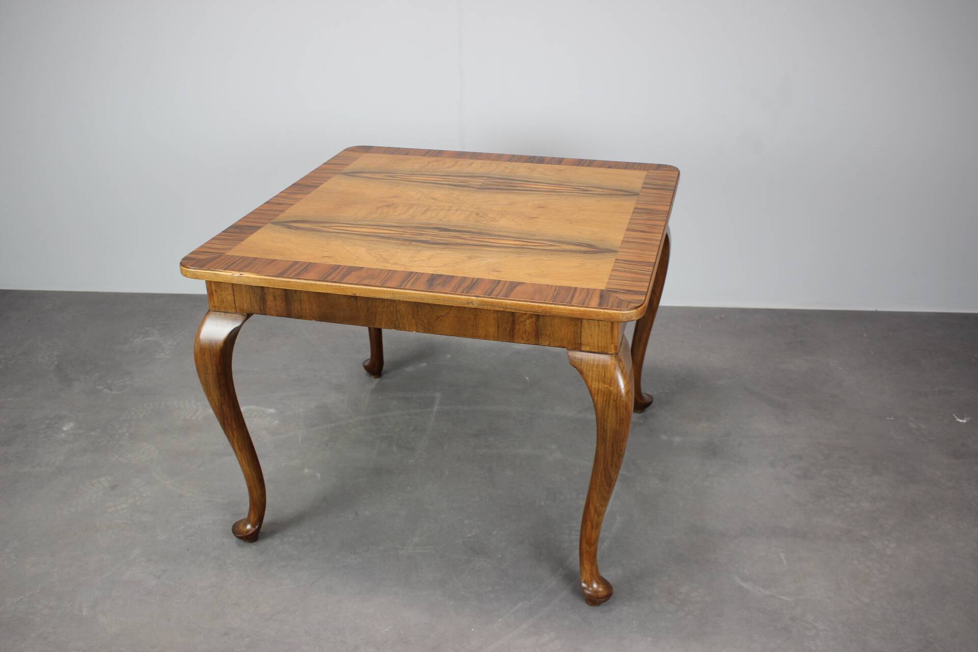 European Art Deco square coffee table from the 1930s in walnut veneer with a restored oiled finish