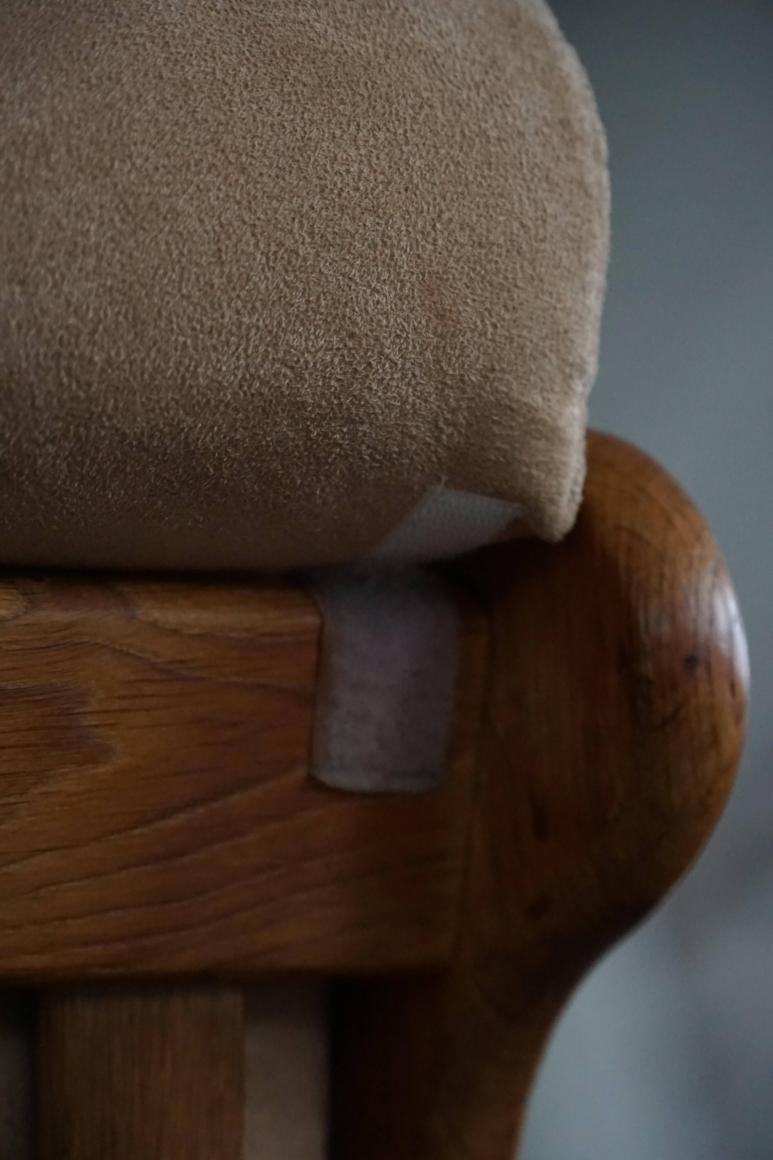 Mid-20th century, pair of armchairs by Henning Kjærnulf, oak and alcantara, 1960s.