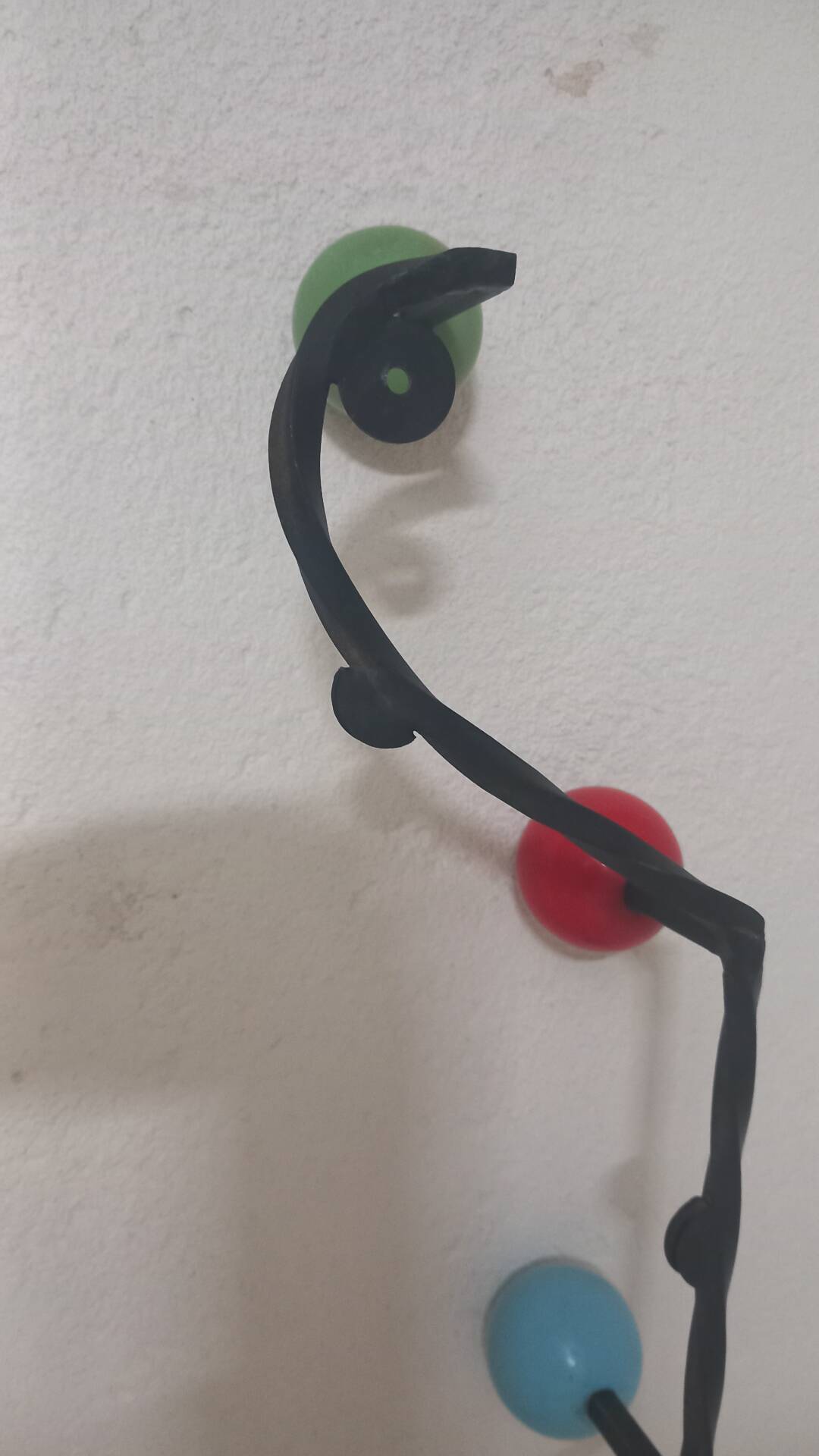 Vintage wall coat rack "Atomic" in wrought iron with multicoloured balls.