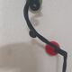 Vintage wall coat rack "Atomic" in wrought iron with multicoloured balls.