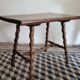 Brutalist coffee table with turned wooden legs