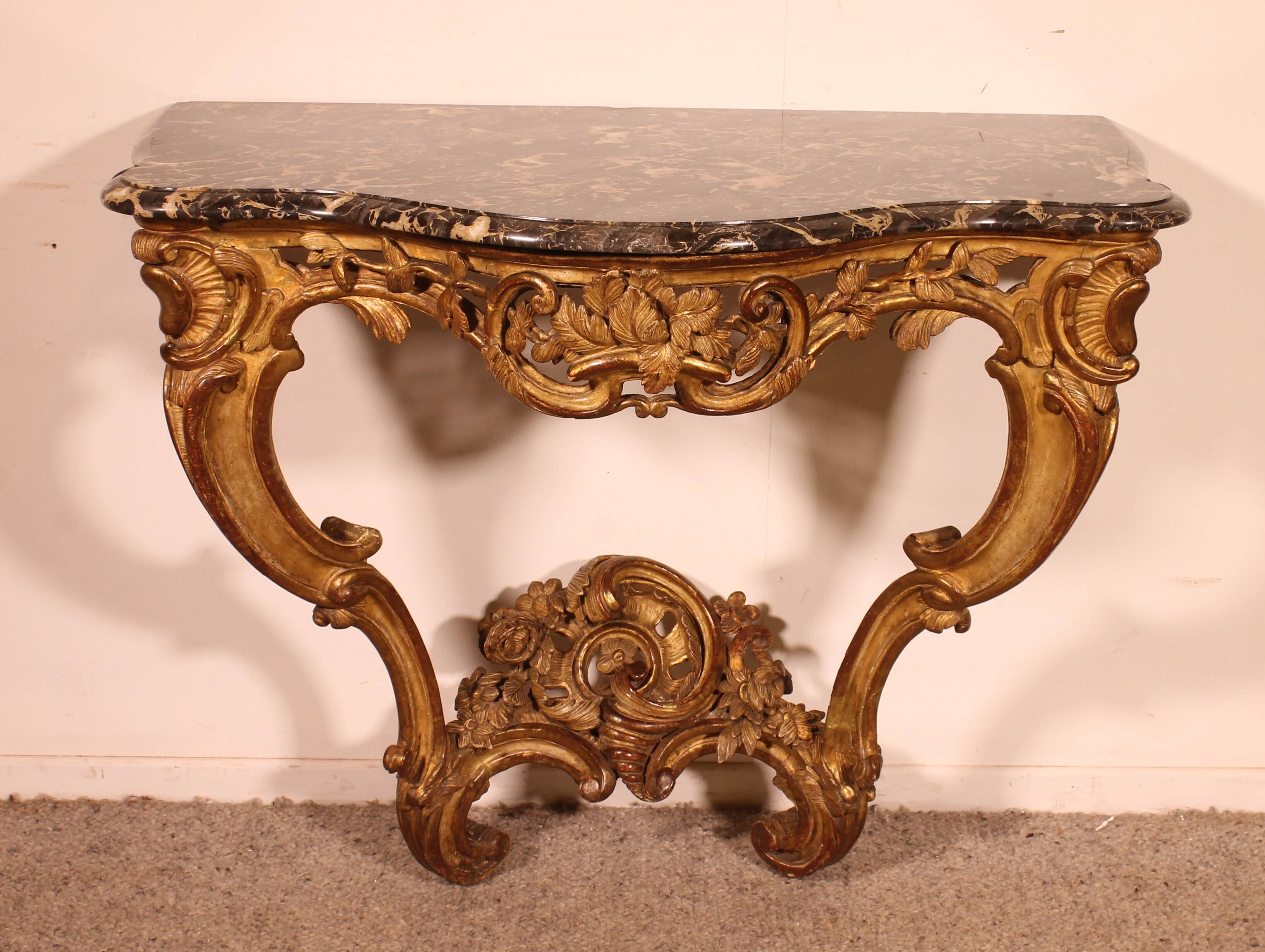Louis XV period console in gilded wood