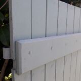 Pair of wooden shutters hanging iron