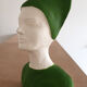 Bust of a woman in green and white plaster