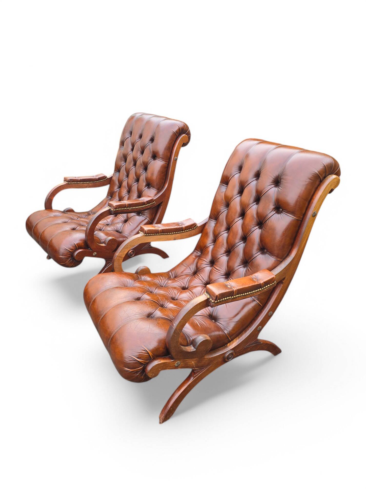 Pair of leather Chesterfields and footstools