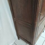 Bonnetière man standing cabinet a door